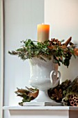 MERRYWOOD, JACKY HOBBS HOUSE, LONDON: DINING ROOM - WHITE FRENCH VINTAGE CERAMIC DECORATIVE URN, CONTAINER, CANDLE, PINE CONES, IVY
