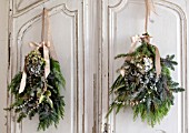 MERRYWOOD, JACKY HOBBS HOUSE, LONDON: WHITE KITCHEN, CHRISTMAS: VINTAGE FRENCH CUPBOARDS, PINE AND HYDRANGEA HANGING BOUQUETS