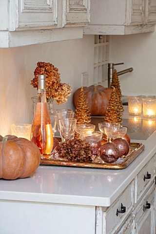 MERRYWOOD_JACKY_HOBBS_HOUSE_LONDON_WHITE_KITCHEN_CHRISTMAS_ORANGE_PUMPKINS_CANDLES_TRAY_BRONZE_AND_G