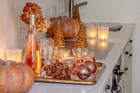 MERRYWOOD_JACKY_HOBBS_HOUSE_LONDON_WHITE_KITCHEN_CHRISTMAS_ORANGE_PUMPKINS_CANDLES_TRAY_BRONZE_AND_G