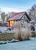 THE OLD RECTORY, QUINTON, NORTHAMPTONSHIRE: DESIGNER ANOUSHKA FEILER: LAWN, SUMMERHOUSE, GRASSES, FROST, WINTER, FROSTY GARDEN, SUNRISE, WALL