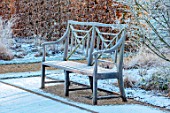 THE OLD RECTORY, QUINTON, NORTHAMPTONSHIRE: DESIGNER ANOUSHKA FEILER: BEAUTIFUL WOODEN BENCH, SEAT BESIDE THE BOULES COURT. FURNITURE, SEATING, FROST, WINTER