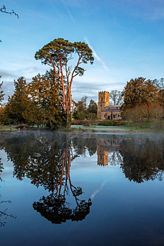 THENFORD_GARDENS__ARBORETUM_NORTHAMPTONSHIRE_REFLECTION_OF_CHURCH_ON_LAKE_POOL_POND_WATER_SPRING