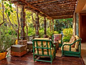 TAROUDANT, MOROCCO: DESIGNERS ARNAUD MAURIERES AND ERIC OSSART: PATIO, TERRACE, GREEN CHAIRS, SEATING, CANOPY, SHADE, SHADY, RELAXING, DECKING
