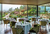 GRAVETYE MANOR SUSSEX: SPRING, APRIL, COUNTRY, GARDEN, THE DINING ROOM WITH VIEW ONTO GARDEN
