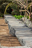 RADICEPURA GARDEN FESTIVAL, SICILY, ITALY: HOME GROUND BY ANTONIO PERAZZI. SEATING, BENCHES MADE FROM RECYCLED STONE SLABS, RECYCLING, SEATS