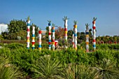 RADICEPURA GARDEN FESTIVAL, SICILY, ITALY: THE BABYLONIAN CRADLE GARDEN, COLOURFUL TOWERS TOPPED WITH AGAVES IN CONTAINERS