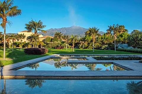 RADICEPURA_GARDEN_FESTIVAL_SICILY_ITALY_VIEW_OF_MOUNT_ETNA_FROM_THE_WATER_GARDENS_PALMS_REFLECTED_RE