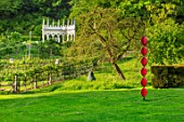 PAINSWICK ROCOCO GARDEN, GLOUCESTERSHIRE: ART UNBOUND - THE EXEDRA. LANDSCAPE, GREEN, BUILDINGS, FOLLIES, RISE 1 BY REBECCA NEWNHAM, MR PEAR BY JOE AND JENNY SMITH