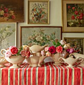 THE LAND GARDENERS, WARDINGTON MANOR, OXFORDSHIRE: CONSTANCE SPRY VASES WITH ROSES ON STRIPEY TABLECLOTH. STILL LIFE, FLOWER ROOM, CUTTING, FLOWERS
