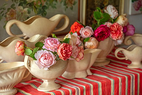 THE_LAND_GARDENERS_WARDINGTON_MANOR_OXFORDSHIRE_CONSTANCE_SPRY_VASES_WITH_ROSES_ON_STRIPEY_TABLECLOT