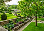 WINSON MANOR, GLOUCESTERSHIRE: LAWN, YEW TOPIARY, CLIPPED, STEPS, BORDERS, RAISED BEDS, CATALPAS, SUMMER, ENGLISH, COUNTRY, GARDENS