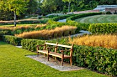 THE NEWT IN SOMERSET: LAWN, SEAT, SEATING, GRASSES, HORNBEAM HEDGES, HEDGING, JULY, ENGLISH, COUNTRY, GARDEN