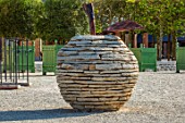 THE NEWT IN SOMERSET: STONE APPLE SCULPTURE BESIDE THE MAIN GATE OF THE WALLED GARDEN. ORNAMENS