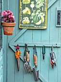 ADAMS POOL, GLOUCESTERSHIRE: BLUE SHED DOOR WITH TOOLS