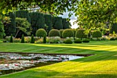 PRIVATE GARDEN, GLOUCESTERSHIRE - DESIGNER ANGEL COLLINS - CANAL AND REFLECTION IN WATER - SUMMER, REFLECTED, REFLECTIONS, FORMAL, GARDEN, CUNTRY, ENGLISH, EVENING LIGHT, CLIPPED
