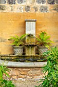 PRIVATE GARDEN, GLOUCESTERSHIRE - DESIGNER ANGEL COLLINS: WALL FOUNTAIN WITH FERNS, WATER, SPOUT