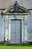 CANONS ASHBY, NORTHAMPTONSHIRE, THE NATIONAL TRUST: GREEN COURT,  THE WEST FRONT, DOOR, COAT OF ARMS CAST IN LEAD