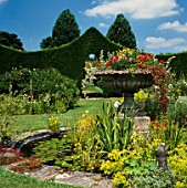 THE  FOUNTAIN OF FLOWERS IN THE CENTRE OF THE LILY POND AT STOURTON HOUSE  WILTSHIRE. DESIGNER: ELIZABETH BULLIVANT