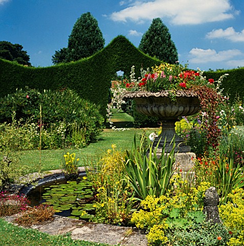 THE__FOUNTAIN_OF_FLOWERS_IN_THE_CENTRE_OF_THE_LILY_POND_AT_STOURTON_HOUSE__WILTSHIRE_DESIGNER_ELIZAB