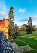 MORTON HALL GARDENS, WORCESTERSHIRE: TOPIARY BALLS AND SCOTS PINE, PINUS SYLVESTRIS, PARKLAND, LAWN, FROM ROOF OF HALL, WINTER, JANUARY