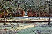 BRYANS GROUND, HEREFORDSHIRE - WINTER GARDEN, FROST, FROSTY, SERPENTINE CANAL, JANUARY, FRUIT TREES, HEDGE, HEDGING, BEECH, VISTA, VIEW, ALONG