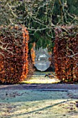 BRYANS GROUND, HEREFORDSHIRE - WINTER GARDEN, FROST, FROSTY, JANUARY, GAP THROUGH HEDGE, HEDGING, BEECH, VISTA, VIEW, ALONG, WOODEN, SEAT, BENCH, FOCAL POINT