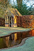BRYANS GROUND, HEREFORDSHIRE - WINTER GARDEN, FROST, FROSTY, SERPENTINE CANAL, JANUARY, WATER, BUILDING, REFLECTED, REFLECTIONS, HEDGE, HEDGING, BEECH, VISTA, VIEW, ALONG