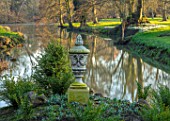 EYTHROPE, WADDESDON, BUCKINGHAMSHIRE: LAKE, SNOWDROP ISLAND, URN, CONTAINER, PARKLAND, TREES, WATER, WINTER, JANUARY, GALANTHUS, REFLECTIONS, REFLECTED