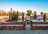CHIPPENHAM PARK, CAMBRIDGESHIRE: THE WALLED GARDEN, BEECH HEDGES, FROSTED LAWN, WINTER, JANUARY, FROSTY, DAWN, SUNRISE