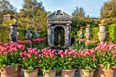 ARUNDEL CASTLE GARDENS, WEST SUSSEX: COLLECTOR EARLS GARDEN, TERRACOTTA CONTAINERS WITH TULIP PINK IMPRESSION, WATERFALL, FOUNTAIN, FOLLY, FOLLIES