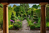 YORK GATE, YORKSHIRE: PORTICO, PATH, HERB GARDEN, CLIPPED, TOPIARY, BOX , YEW, SUMMERHOUSE, HEDGES, HEDGING, SUMMER, JUNE, ALLIUMS