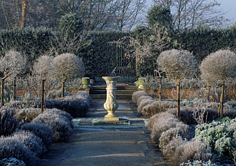 VIEW_ALONG_PATH_TO_SUNDIAL_IN_FROST_COVERED_SCENTED_GARDEN_HATFIELD_HOUSE__HERTFORDSHIRE