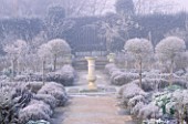 VIEW ALONG PATH TO SUNDIAL IN FROST COVERED SCENTED GARDEN HATFIELD HOUSE  HERTFORDSHIRE