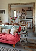 ASHBROOK HOUSE, NORTHAMPTONSHIRE: GUEST COTTAGE, SOFA AND VIEW THROUGH TO KITCHEN