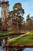 HEVER CASTLE & GARDENS, KENT: LAKE, POND, BRIDGE, TREES, DAFFODILS, NARCISSUS, SPRING, MARCH, WATER