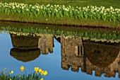 HEVER CASTLE & GARDENS, KENT: LAKE, POND, DAFFODILS, NARCISSUS, SPRING, MARCH, WATER, REFLECTIONS, REFLECTED,  CASTLES