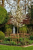 MORTON HALL GARDENS, WORCESTERSHIRE: CLIPPED, BOX TOPIARY, STATUE, MAGNOLIA KOBUS OCTOPUS, FORMAL, GARDEN, VIEWPOINT, FOCAL POINT, LAWN