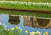 HEVER CASTLE & GARDENS, KENT: LAKE, POND, DAFFODILS, NARCISSUS ICE FOLLIES, SPRING, MARCH, WATER, REFLECTIONS, REFLECTED,  CASTLES