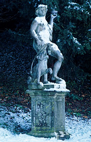 A_STATUE_IN_THE_SNOW_AT_ROUSHAM_PARK__OXFORDSHIRE