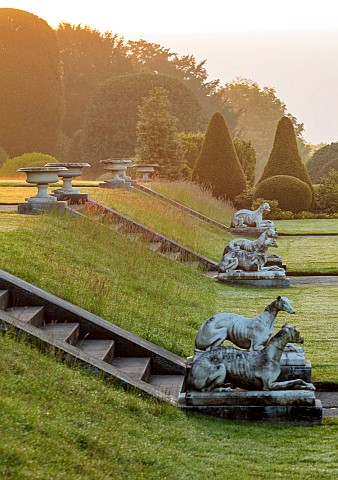BRODSWORTH_HALL_YORKSHIRE_THE_HALL_AT_DAWN_SUMMER_LAWNS_CLIPPED_TOPIARY_STEPS_DOG_STATUES