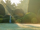 BRODSWORTH HALL, YORKSHIRE: SUMMER, CLIPPED TOPIARY HEDGES, HEDGING, DAWN, SUNRISE, MIST, FOG, GRASS, LAWN, STATUE