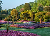 BRODSWORTH HALL, YORKSHIRE: SUMMER, CLIPPED TOPIARY HEDGES, HEDGING, BEDDING, LAWN, LABURNUM ARCH, FORMAL BEDDING, TREES, VICTORIAN