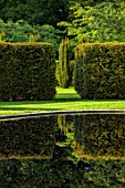 URCHFONT MANOR, WILTSHIRE: YEW HEDGING, HEDGES, FORMAL, CONTEMPORARY, GREEN, LAWN, WATER, POOL, POND, BLACK, DESIGNERS DEL BUONO GAZERWITZ, ELEANOR JONES, REFLECTED, REFLECTIONS