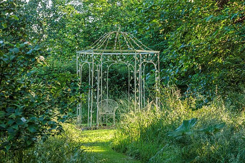WESTBROOK_HOUSE_SOMERSET_ORNATE_METAL_ARBOUR_GRASS_WOODLAND_WILD_COUNTRY_GARDEN_LAWN_GRASS_PATH_TREE