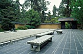 SIMPLE WOODEN BENCHES AND RAKED GRAVEL IN THE JAPANESE ZEN GARDEN AT THE HUNTINGTON BOTANICAL GARDENS  CALIFORNIA