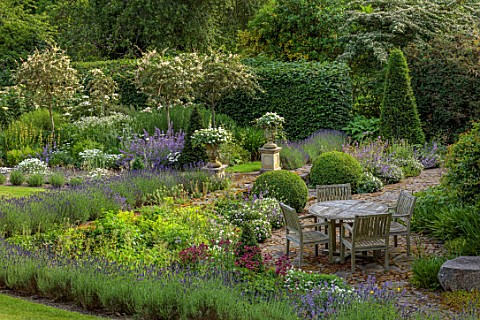 HURDLEY_HALL_POWYS_WALES_SUMMER_JULY_BORDERS_LAVENDER_TABLE_CHAIRS_ASTRANTIA_BORROWED_LANDSCAPE