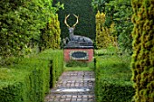 HE LASKETT GARDENS, HEREFORDSHIRE. DESIGNER ROY STRONG - VIEW, VISTA, CLIPPED TOPIARY YEW HEDGES, HEDGING, CHILSTONE STAG, THE CHRISTMAS ORCHARD, JULY, SUMMER
