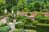 THE LASKETT GARDENS, HEREFORDSHIRE. DESIGNER ROY STRONG: HOWDAH COURT, SEEN FROM VIEWING PLATFORM, JULY, SUMMER, CLIPPED TOPIARY, URNS, CONTAINERS, WALLS, GREEN, GARDEN