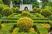 THE LASKETT GARDENS, HEREFORDSHIRE. DESIGNER ROY STRONG: THE NYMPHAEUM IN JULY, SUMMER, CLIPPED, TOPIARY, BUILDING, GARDEN, PILLARS, EAGLE, SCULPTURE